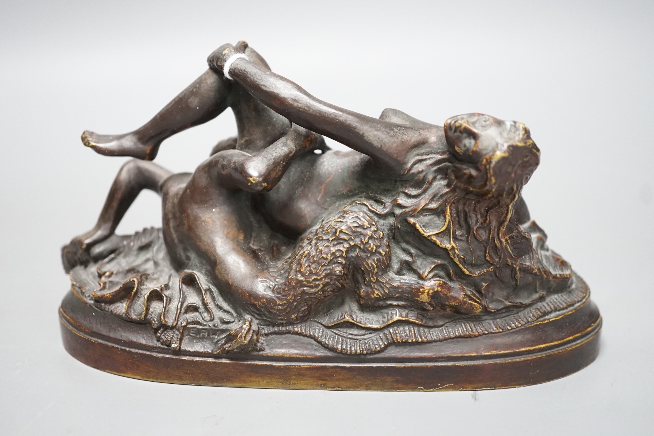 A 20th century erotic and demonic bronze figure group, 20cm long